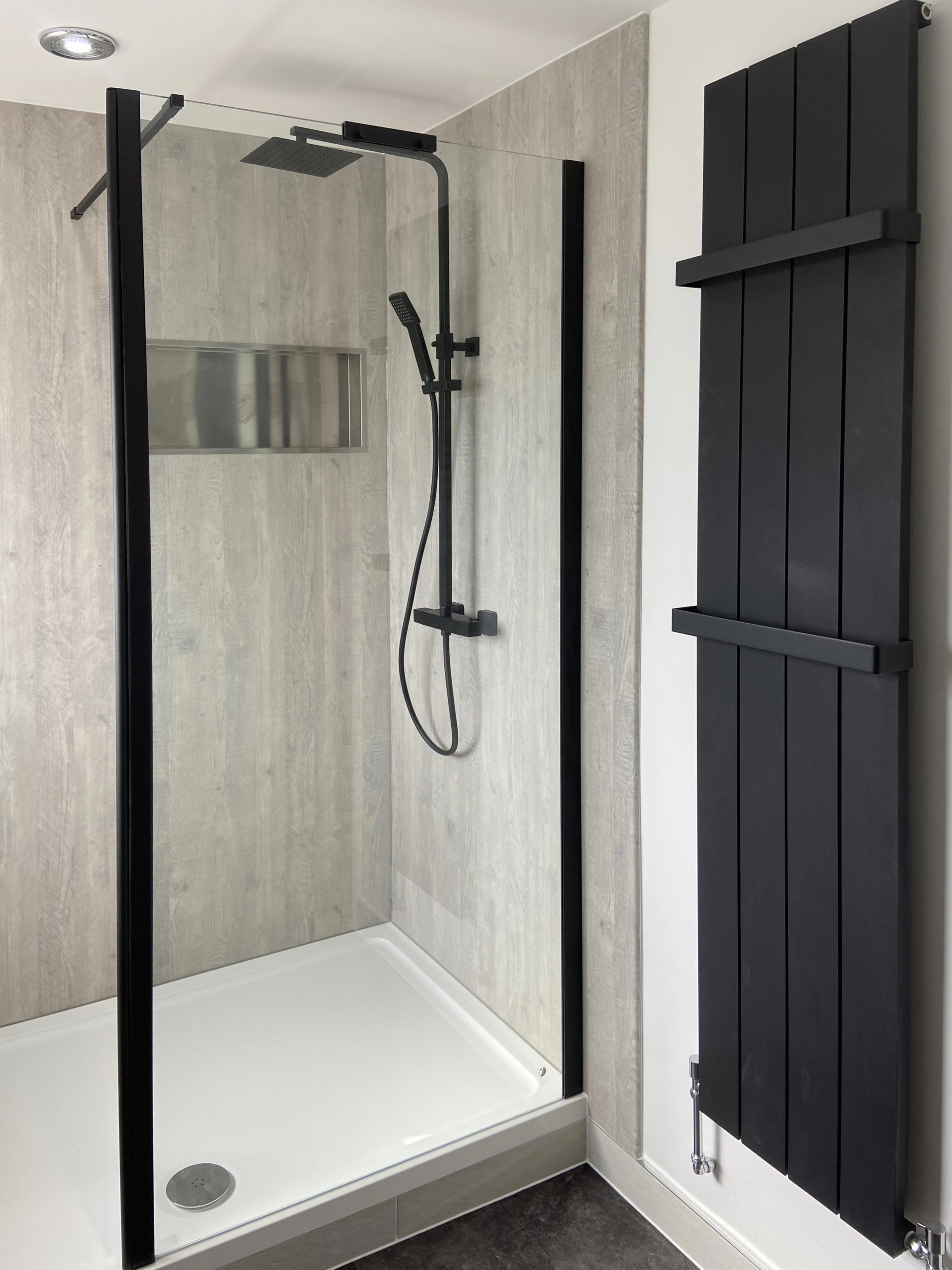 new shower with modern heated towel rack